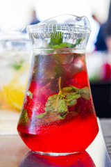 fruit drinks in decanters and glasses