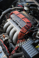 Fototapeta premium Close up detail of clean car engine with red wire