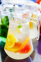 fruit drinks in decanters and glasses