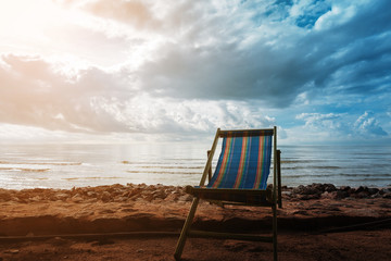 Beach chair in sunrise at seaside.relax vacation concept.