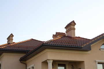 Close up of spacious brown shingle roof of modern luxurious expensive residential cottage house...
