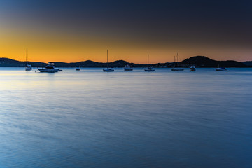 Sunrise Waterscape with Boats on the Bay