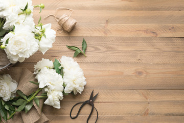 White peonie flat lay with copy space