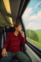man traveling by train