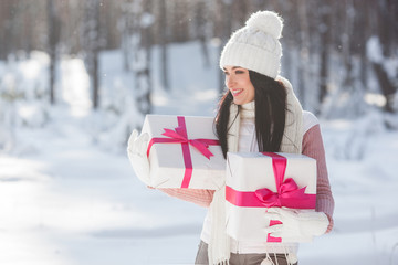 Young attractive woman with christmas presents