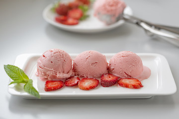 Tasty creamy strawberry ice cream with fresh ripe red succulent fruit 