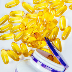 Close up of capsules Omega 3 on white background. Top view, high resolution product. Health care...