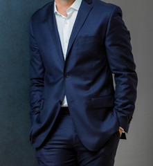 Close-up cropped Caucasian hands and arms of businessman in a suit