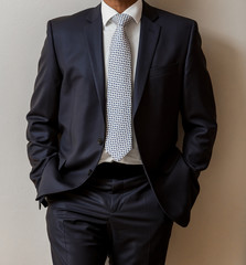 African Black hands and arms of businessman in a suit