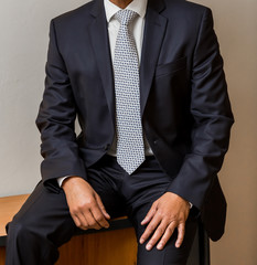 African Black hands and arms of businessman in a suit