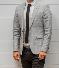 Close-up cropped Caucasian hands and arms of businessman in a suit