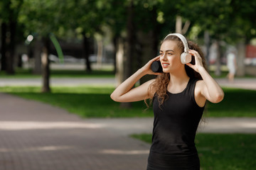 woman listening to music on headphones