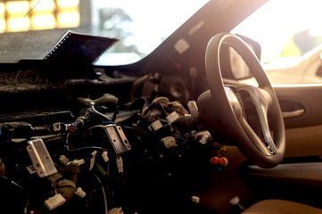 closeup interior in the car steering wheel repair after the accident with soft-focus and over light...