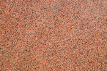 The texture of a granite slab. Red