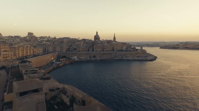 Craning up with a fort in foreground. Valletta, Malta
