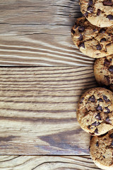 Fototapeta na wymiar Chocolate cookies on table. Chocolate chip cookies shot with chocolate