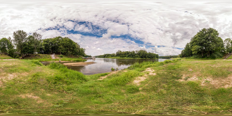 full seamless spherical panorama 360 by 180 degrees angle view on the shore of width river in...