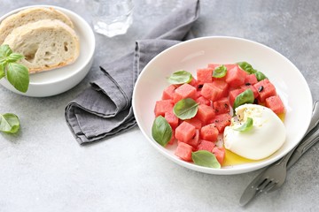 Watermelon Mozzarella Salad with basil and olive oil. Selective focus