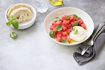 Watermelon Mozzarella Salad with basil and olive oil. Selective focus