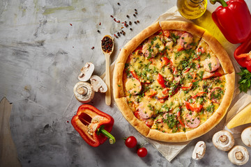 Tasty Italian pizza and its ingredients on white textured background.