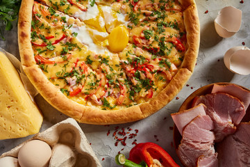 Tasty Italian pizza and its ingredients on white textured background.