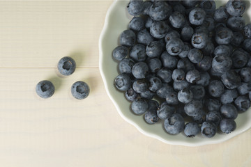 Blueberries summer berry on wooden table. Vitamin C, E, P, PP, B carotene flavonoids ascorbic acid. Organic fresh antioxidant food