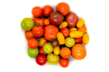 Fresh, ecological and colorful different type tomato isolated on white background