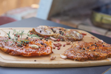 Slices of raw and grilles pork meat