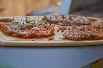 Slices of raw and grilles pork meat