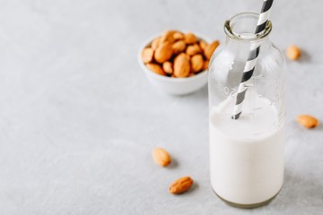 Homemade almond milk in a glass bottle.