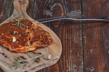 Slices of raw and grilles pork meat