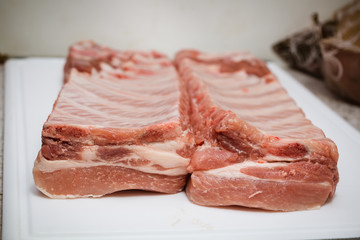 piece of meat ribs is prepared in the kitchen on the board