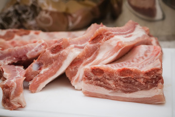piece of meat ribs is prepared in the kitchen on the board