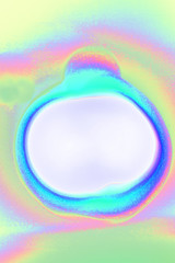 Abstracted photograph showing a whitecircle inmidst pastel colored cyan,blue 