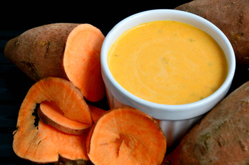 Salad cream made from sweet potato steamed and raw potatoes on black tray.
Homemade Sweet Potatoes Menu eating with fresh vegetable for healthy.