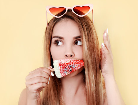 Young woman eating ice cream