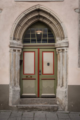 Fototapeta na wymiar Old wooden door in old town, Tallinn, Estonia.