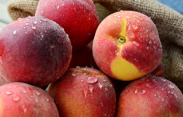 Many Fresh Peach with water drops and shadow on wooden background (German name is Pfirsich)
The amount of sugar in peaches is a lot natural and does not negatively affect health.