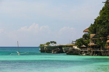 Terrace by turquoise water and small banka in Boracay, Philippines. Paradise holidays, summer...