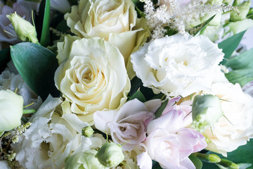 beautiful wedding bouquet with white roses and other flowers on wooden background  with 2 wooden pigeons