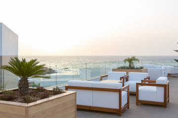Sunset in cafe bar in sea hotel resort