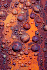 Mars-like landscape created with several paints on Glycerine which are forming little colorful balls and isles