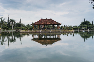 Bali, Indonesia: Panoramic view of building on lake shore with reflection in water