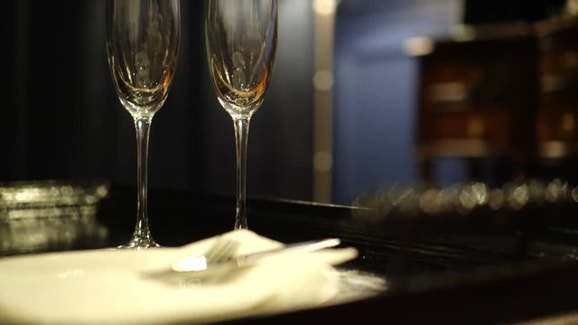 Two empty champagne glasses in luxury interior room for romantic anniversary