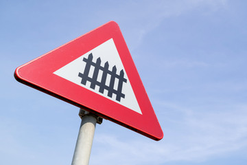 Dutch road sign: level crossing with barrier or gates ahead