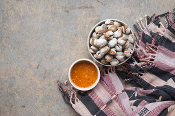 Cockles seafood boiled served with Thai spicy sauce.