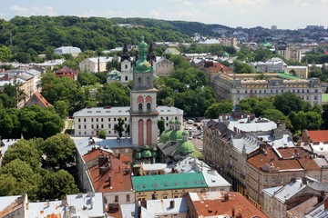 Fototapeta na wymiar Dormition Church in the old town in Lviv from a bird's eye view, Ukraine