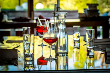 Fototapeta na wymiar Glasses and Bottles on the Table