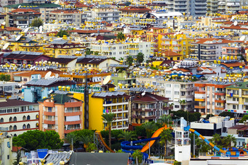 the roofs of different houses from the height of the birds flight. various hotels with cisterns and conditioners. aerial view of the city