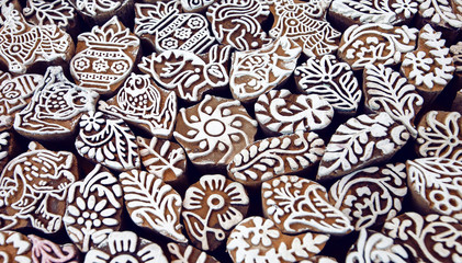 Wooden mold blocks for traditional printing textile with patterns and symbols. Old local design of Asia.